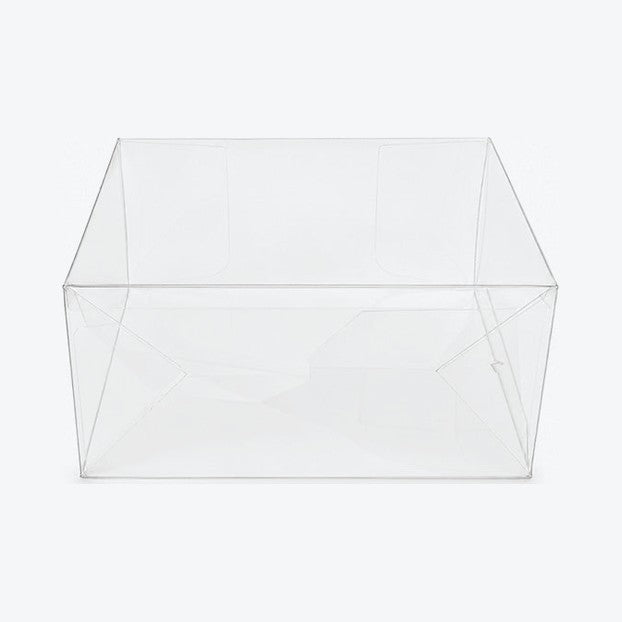 Empty clear ETB protector viewed from below, showing the pop-and-lock bottom