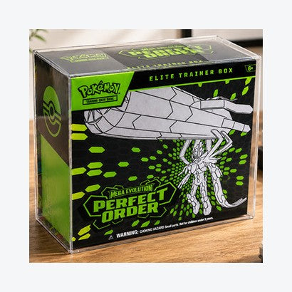 Clear protector fitted over a sealed Elite Trainer Box on a wooden desk
