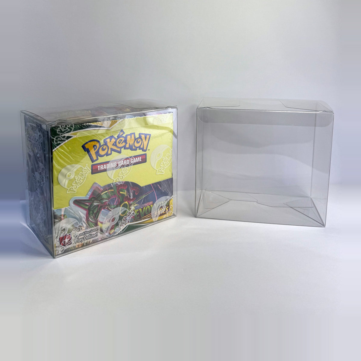 Booster box in a clear Sealed Armor protector next to an empty protector