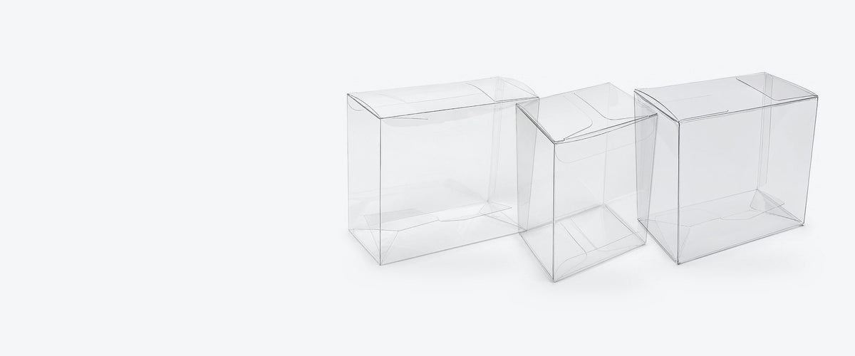 Three empty clear PET protectors for an Elite Trainer Box, booster bundle and booster box