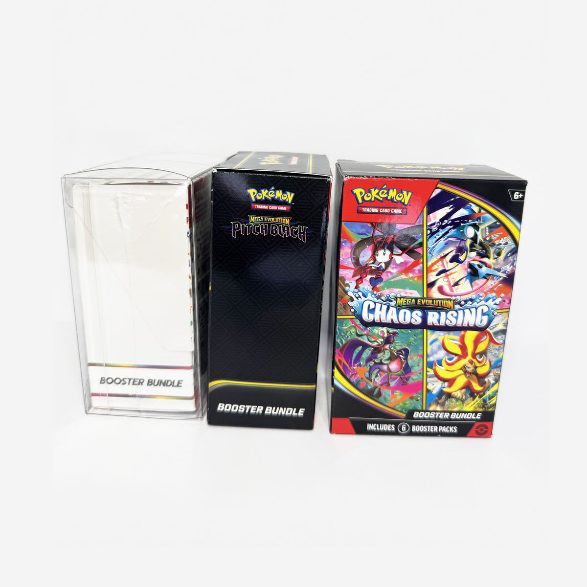 Tall booster bundles next to a standard booster bundle in its protector, showing the height difference